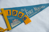Vintage felt pennant detail showing yellow edge binding and blue '19' numerals.