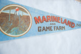 Vintage Marineland pennant, Orca whale graphic doing tricks on blue felt.