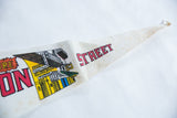 Pointed tip of vintage Bourbon Street felt pennant with 