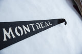 Close-up of the classic white lettering and texture of the vintage Montreal felt flag.