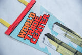 Close-up of vintage World Trade Center felt pennant, showing red border and 1973 copyright.