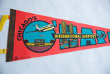 Yellow felt tie and black 'CHICAGO'S' lettering on the red vintage pennant.