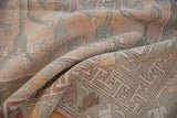 Distressed Oushak carpet with woven tree of life motif and geometric border in soft rose and silver.