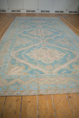 Low angle view showing the zig-zag and wave borders of a vintage Soumac runner.