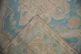 Corner of the vintage Soumac runner folded back to show the flatweave construction and secured selvage.