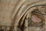 Distressed Oushak rug with even wear to knot heads, featuring blush and powder blue.