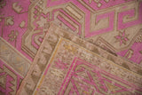 A folded corner of the distressed Soumac carpet displays its flatweave texture and original side selvage.