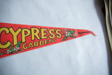 Vintage red felt Cypress Gardens pennant with pointed end and FLORIDA text.
