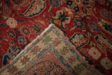 Vintage Northwest Persian rug's cherry red pile, intricate floral and boteh motifs, with its woven back.