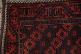 Antique Belouch rug corner with geometric latch palmettes and bold ivory wave vine border.