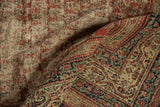 Distinctive reciprocating pawn motif on an antique Serbend rug border in madder red and ivory.