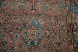 Blue scalloped medallion with palmette florals on unusual purple Yezd rug field.