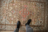 Distressed vintage Turkish Kaisary rug with dusty bronze, blush, and ivory tones underfoot.