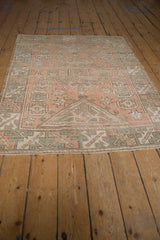 Distressed vintage Melas rug, lower section showing geometric patterns, pale dusty rose, oxidized silver tones.