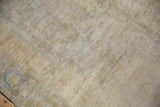 Distressed Oushak rug pile texture with even short height, abrashed beige, pale sand, and dusty blue.