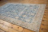 Distressed vintage Sparta carpet, faded pale navy trellis panel with ivory buds.