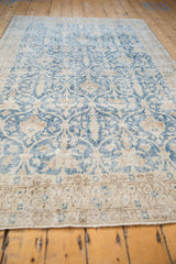 Distressed vintage Sparta rug pattern featuring pale navy trellis and ivory Cyprus trees.