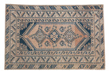Vintage distressed Melas rug: triple gul medallion, abrashed peach field, navy geometric borders.