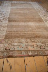 Vintage Distressed Kars carpet border with colorful floral patterns and subtle field.