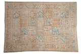 Distressed Turkish Bakhtiari rug with four-seasons panels in pale terra cotta, ivory, and pale denim blue.