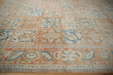 Angled view across the low-pile texture of a vintage Bakhtiari design panel carpet.