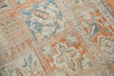 Textured knot heads within the repeating panel design of a vintage Turkish Bakhtiari carpet.