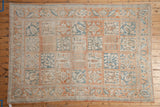 Vintage Bakhtiari design carpet with time-softened colors and a repeating four-seasons panel layout.