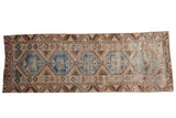 Distressed Oushak runner with pale blue geometric medallions on an ivory field, 3x9 feet.