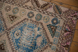 Distressed Oushak runner with sky blue guls, brown T border, and pale pink serrated leaf border.