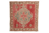 Distressed Oushak square rug with oversized floral medallion in faded red, blush, beige. Size 2'3