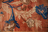 Arts and crafts stylized florals with abrashed field, distressed pile in brick red and blue.