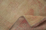 Vintage distressed Oushak rug showing worn pile, faint foundation, and woven reverse.