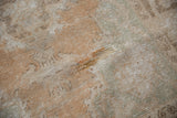 Distressed vintage Oushak rug showing knot heads, foundation, and muted sandalwood seafoam tones.