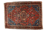 Antique Fine Farahan Sarouk rug: central diamond medallion, brick red field, sapphire blue floral details.