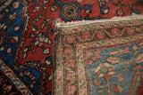 Antique Farahan Sarouk rug: brick red, sapphire floral pile alongside fine knotting and intact selvage.