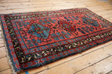 Vintage Mehreban rug corner, reciprocating trefoil pawn border, pale raspberry and sky blue floral motifs.