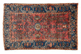 Vintage Lilihan rug, roundel floral medallion, dusty cochineal red field with abrash, indigo blue, 2'6