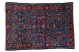 Fine vintage Lilihan rug with sapphire blue field, brick red borders, allover blossom motif.