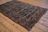 Antique Hamadan rug with cobalt blue, copper shrimp motifs, serrated leaf border, and visible patch.