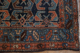 Antique Hamadan rug detail with serrated leaf border and shrimp motif in cobalt, dusty copper.