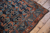 Unusual cobalt and copper shrimp motif, serrated leaf border on antique Hamadan rug.