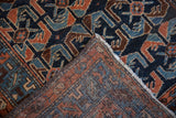 Antique Hamadan rug corner, hand-knotted pile, and foundation in cobalt blue, copper geometric.