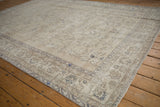 Vintage distressed Sparta rug detail: sprawling faded vinery, dusty blue tones, mostly even wear to knot heads.