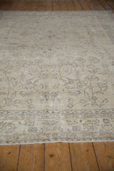 Vintage distressed Sparta rug surface, mostly even wear exposing foundation, with faded blue vinery.