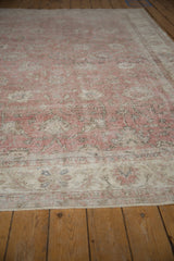 Distressed rose and ivory patterns with visible foundation on the vintage Sivas carpet.