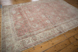 Distressed Sivas carpet corner displaying rose, ivory, oxidized silver palmettes and evident wear.