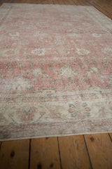 Distressed Sivas carpet's secured end showing worn rose and ivory tones, visible knot heads.