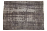 Vintage overdyed Oushak carpet with a distressed roundel medallion in charcoal and dusty mauve.