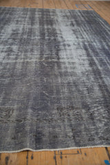 Angled view across the distressed pile, showing the dynamic texture of the vintage Oushak.