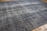 Textured wear across the knot heads of a distressed, overdyed Turkish Oushak rug.